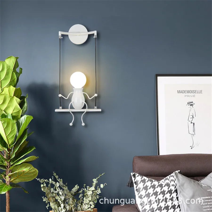 Creative Little Figurine on Swing Wall Sconces - Lumen Attic